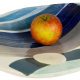 apple on ceramic bowl